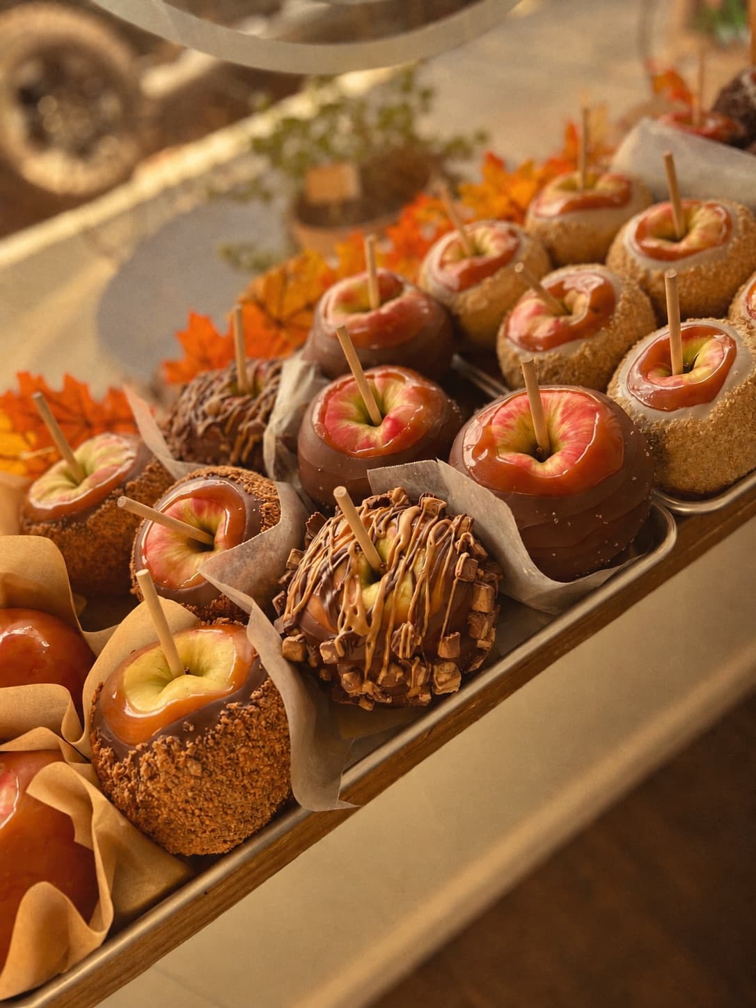 Caramel apples on a vendor table